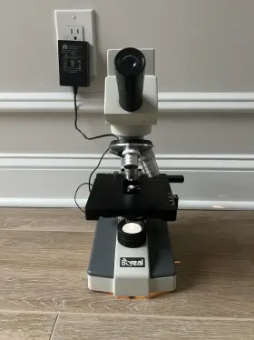 57900-01 Boreal Model Microscope And Power Cord Plugged In/working Plain Slides