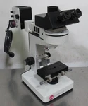 T199186 Leitz Laborlux D Trinocular Microscope W/ Ef 4X Objective. Fixed Price $300.00.