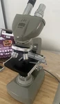 Bristolscope Bristoline Compound Microscope W/ Case. Missing One Ocular Lens.. Fixed Price $250.00.