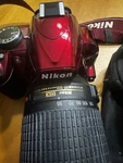 Nikon D3100 14.2MP Digital Slr Camera - Red Kit Lenses, Batteries Bag Tripod. Fixed Price $300.00.