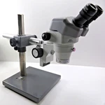 Nikon SMZ645 Stereo Microscope, C-W10XA/22, G-al 2X W/ Boom Stand. Fixed Price $785.00.